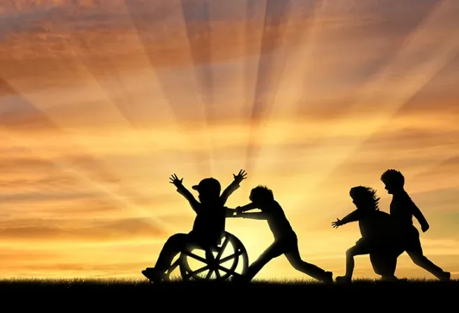 Young Children Playing with Child in Wheelchair