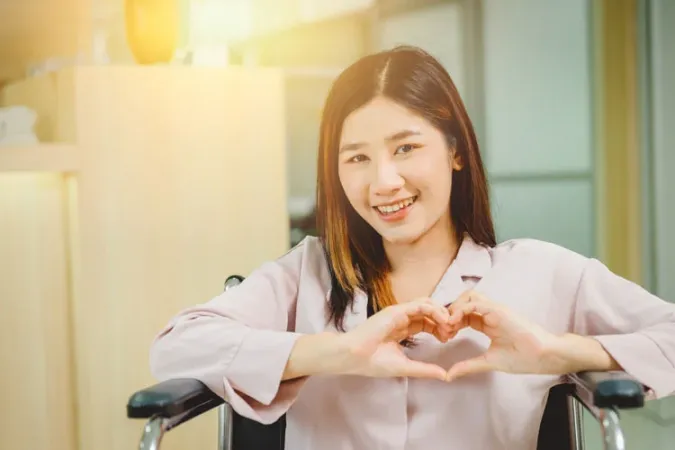 happy girl making a heart with her hands