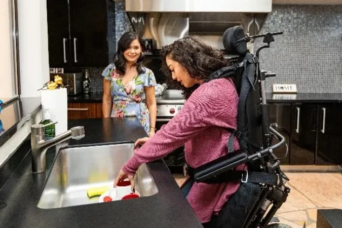 Woman in Power Chair Preparing a Meal