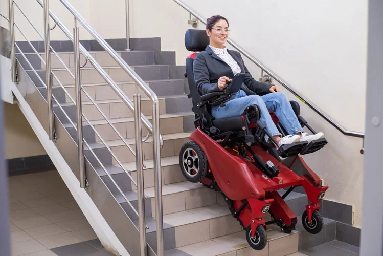 woman on wheelchair getting downstairs