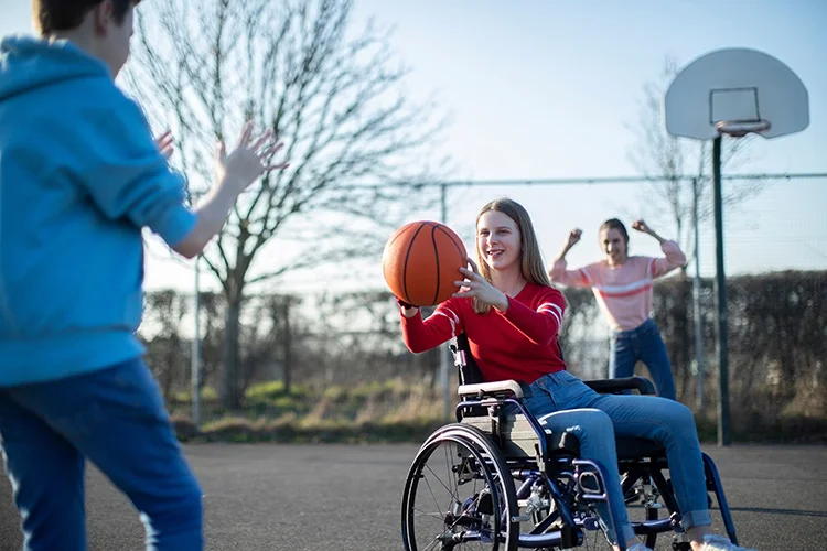 Practice Compassion - Disabled Girl Playing Basketball with Her Peers