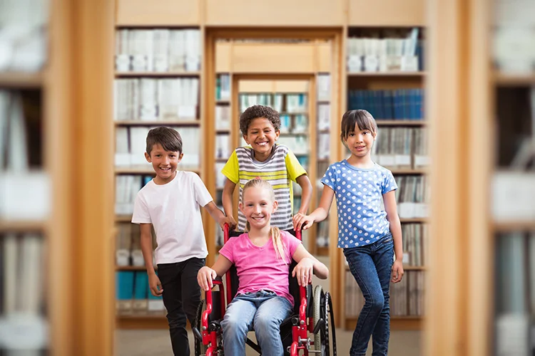 Young Disabled Girl in Library with Her Classmates
