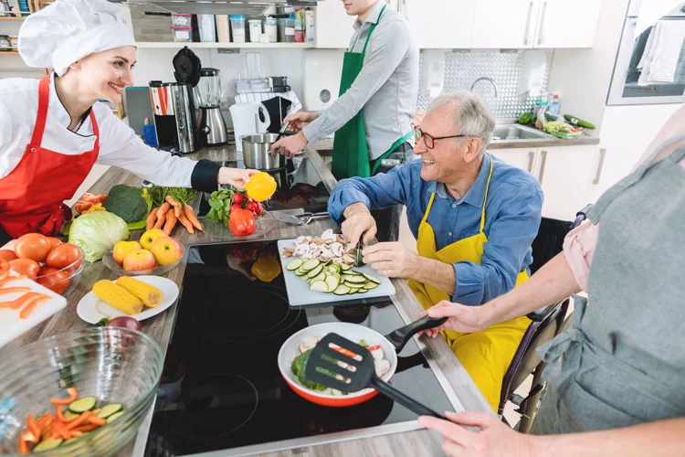 an old man on his wheelchair preparing healthy food