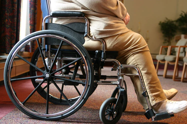 overweight woman sitting on her wheelchair
