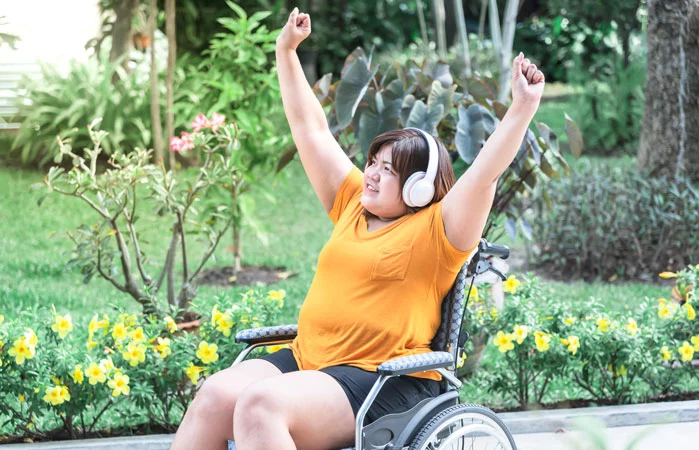 happy woman on her wheelchair