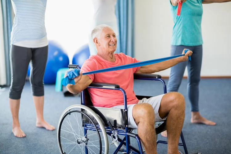 an old man doing exercises on his wheelchair