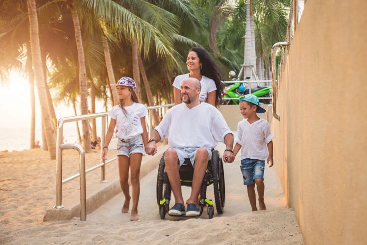 wheelchair man with his family on a vacation