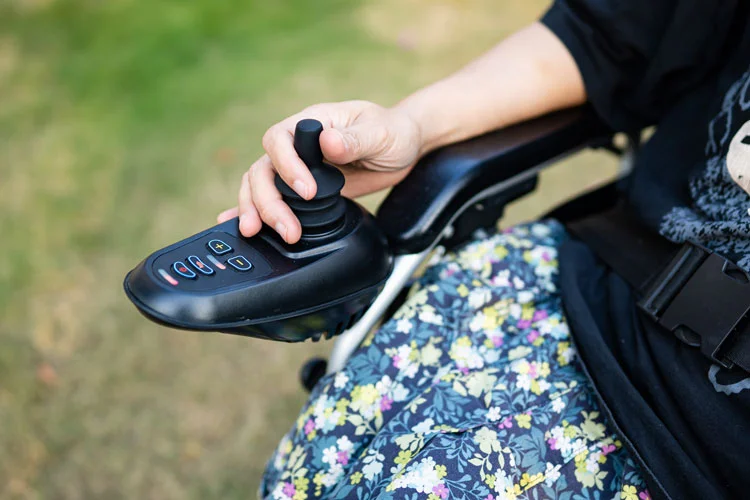 a woman using electric wheelchair 