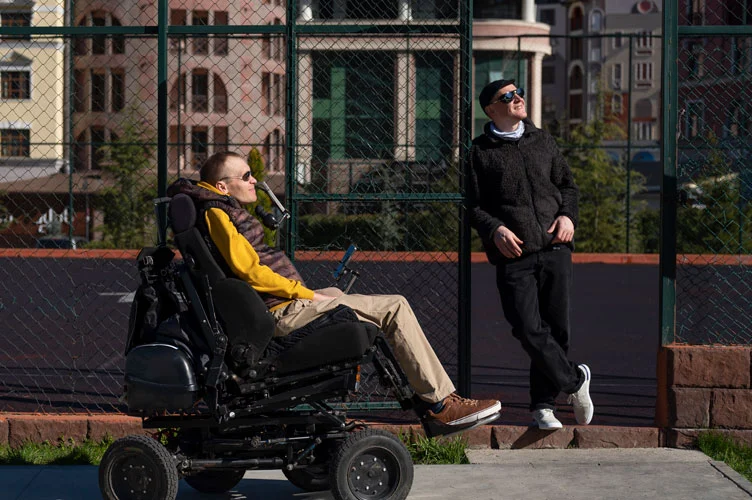 a person navigating public spaces on a power chair