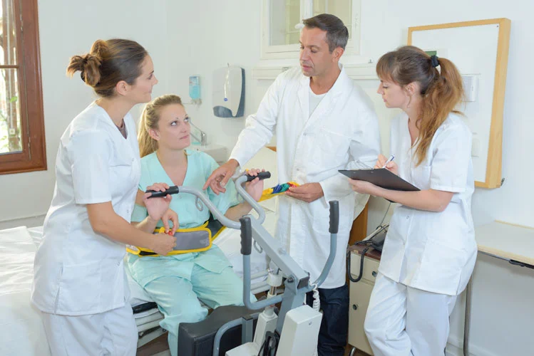 doctors and nurses talking to patient