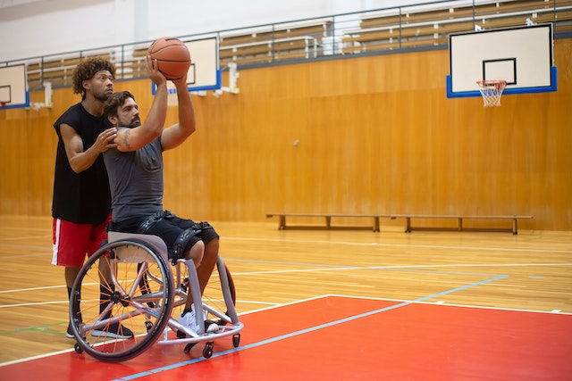 Person in a wheelchair playing basketball