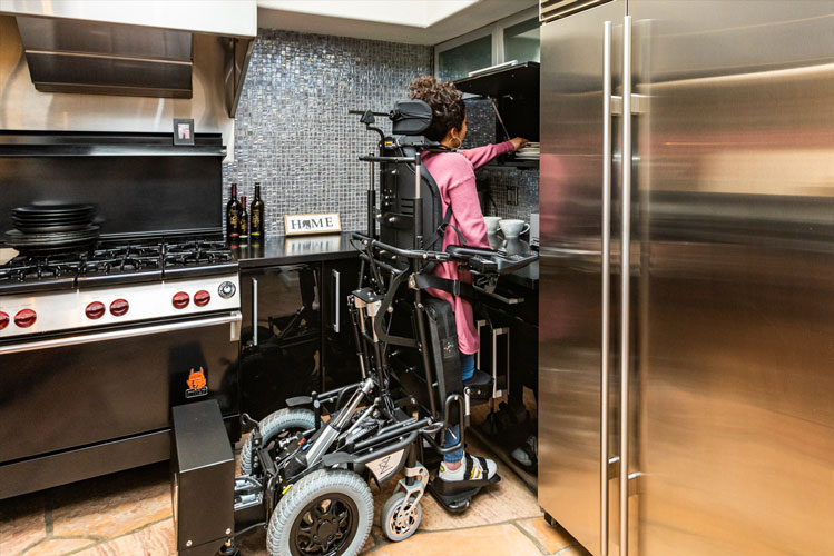 a powerchair user cooking food
